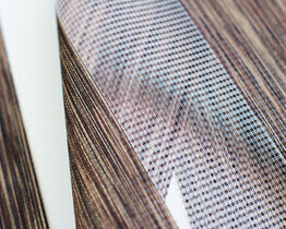 Modern day and night roller blind with guides