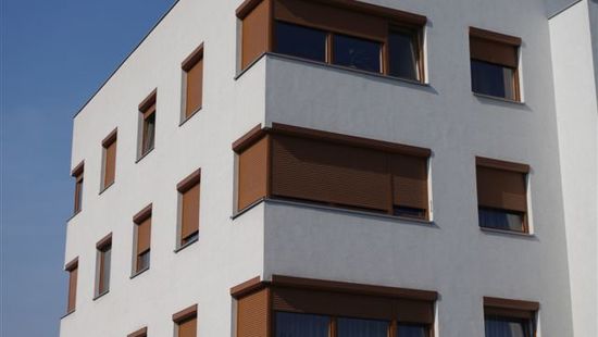 
																					external electric roller shutters in an apartment block
																						